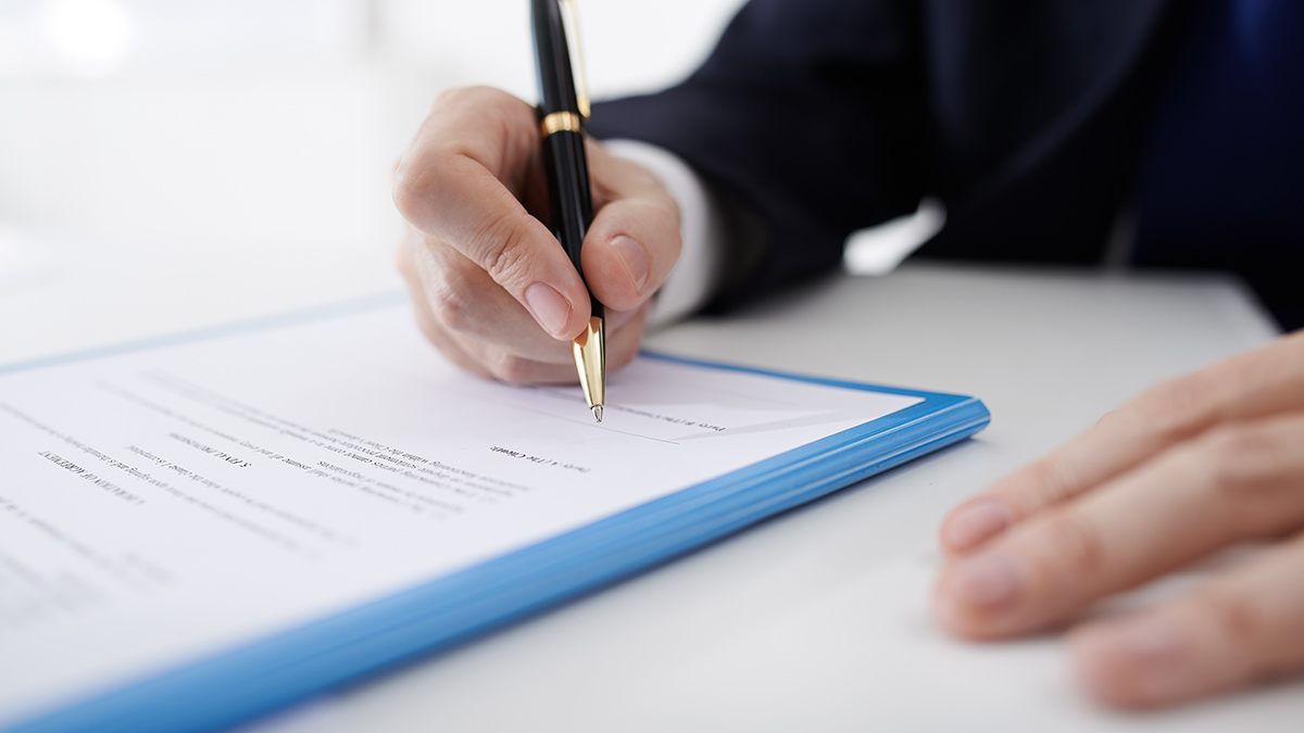 business person signing a service agreement