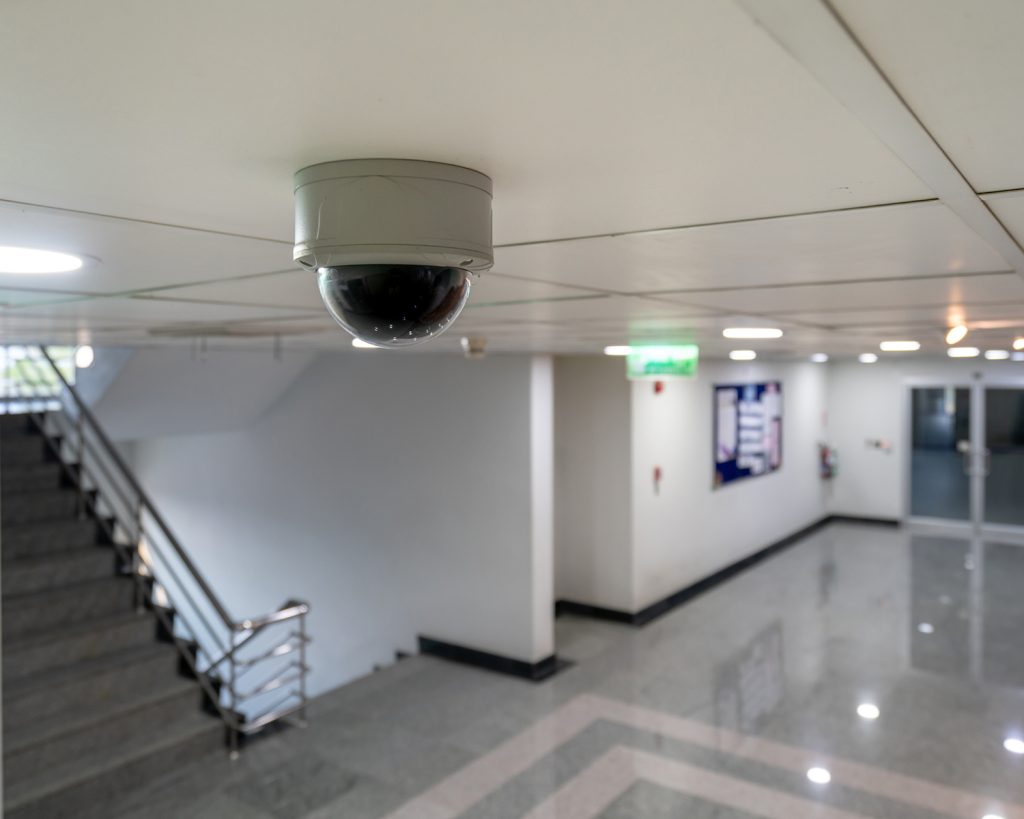 Indoor cameras monitoring facilities looking at the stair and access control door for high security safety.