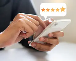 hands holding smart phone and choosing 5 star rating.