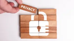 Business, Technology, Internet and network concept. Young businessman shows the word: Privacy