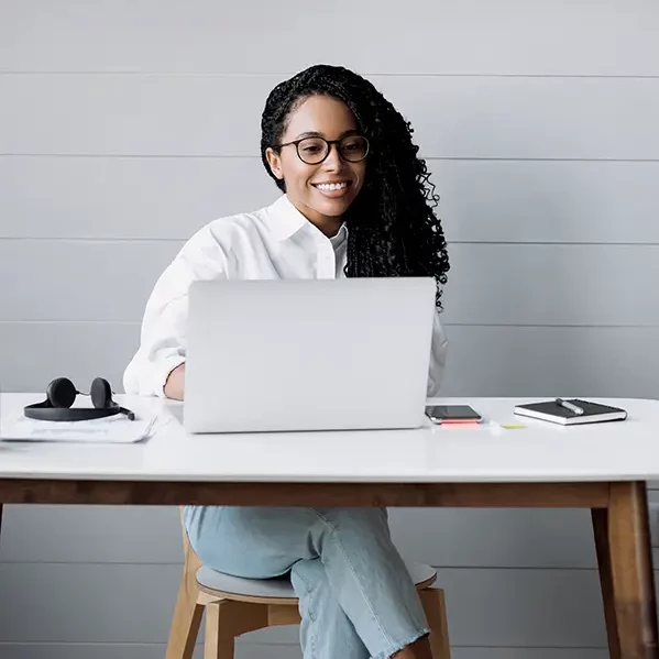 African American Woman using a laptop on her office desk