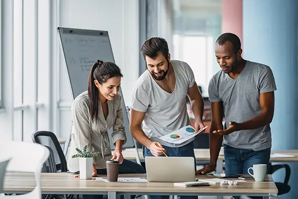 Employees planning near computer.