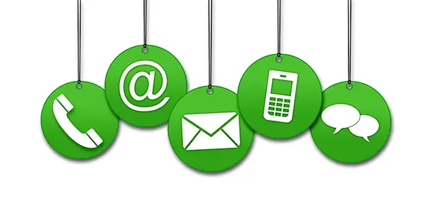 Contact symbols hanging like an ornament on circles including phone, email, cell phone and chat symbols.